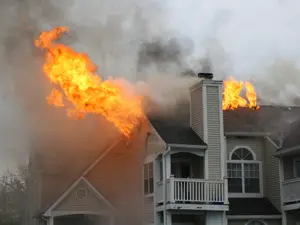 Doctor Found Slain in Burning Home