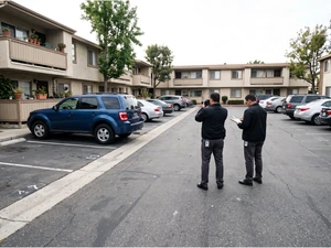 Woman Charged After Friend Killed In Apartment Lot